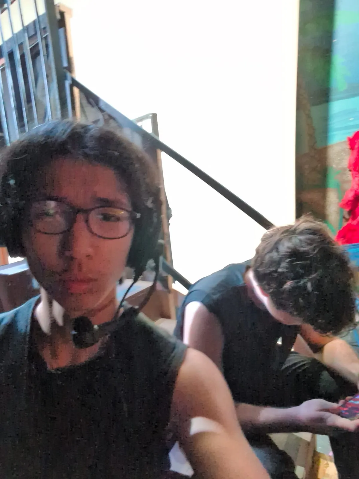Ian backstage in costume with a stage mic