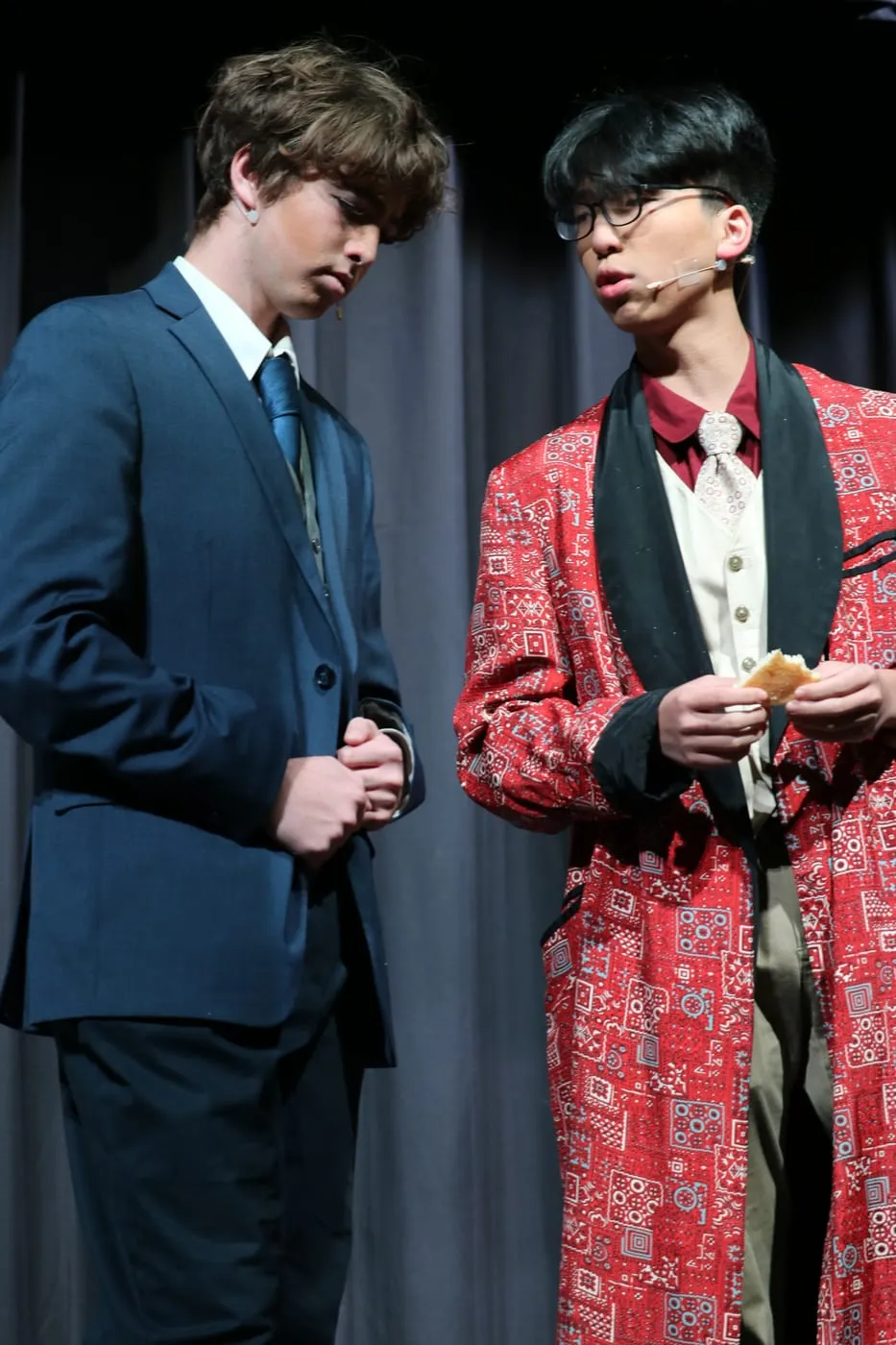 Ian on stage in a red patterned dressing gown, in scene with another actor